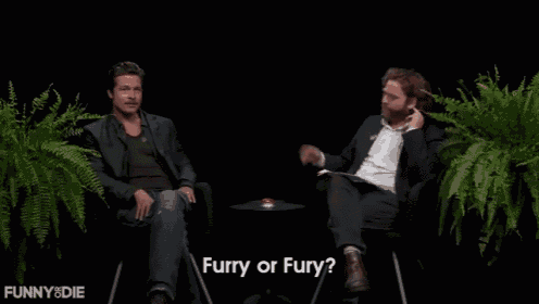 a man with a mustache is talking to another man and the man is asking if he is furry or fury