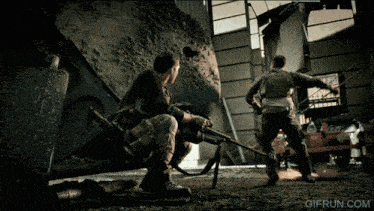 two soldiers are standing in a room with a gifrun.com watermark on the bottom right