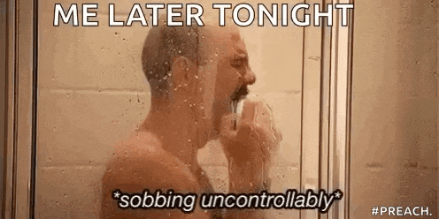 a shirtless man is taking a shower in a shower stall with a funny caption .
