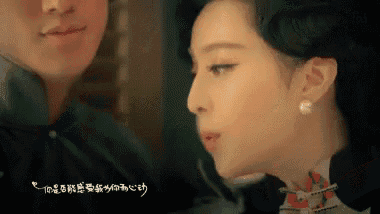 a man and a woman looking at each other with chinese writing on the bottom