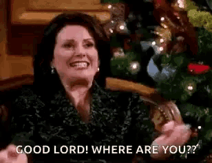 a woman is sitting in front of a christmas tree and says `` good lord where are you ? ''