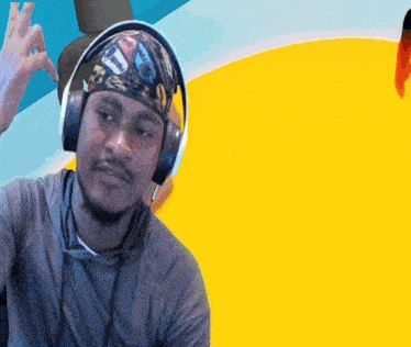 a man wearing headphones and a bandana that says u. on it