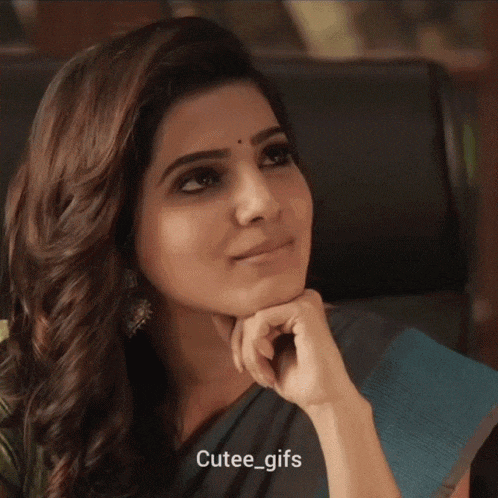 a close up of a woman 's face with cutee_gifs written below her
