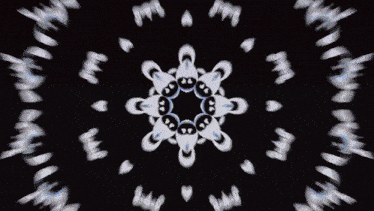 a black and white kaleidoscope with the letter n in the middle