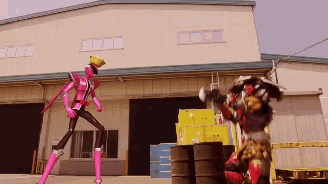 a woman in a pink costume is standing in front of a building