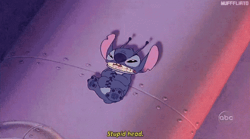 a cartoon character from the movie lilo and stitch is laying on a purple surface and says stupid head .