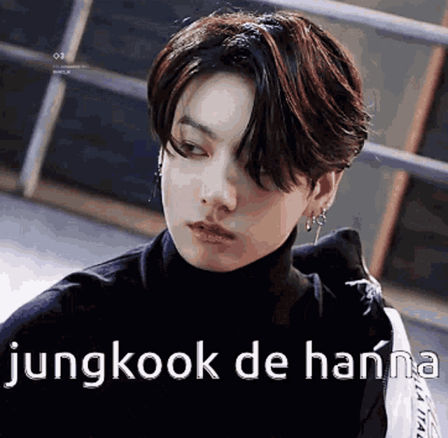 a young man wearing a black turtleneck sweater and earrings says jungkook de hanna