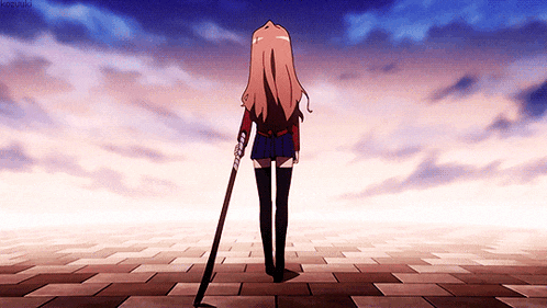 a girl is holding a cane in her right hand and looking up at the sky