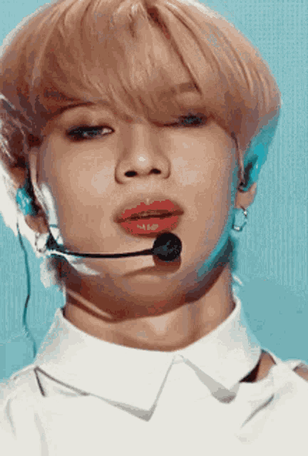 a close up of a person wearing a microphone on their face .