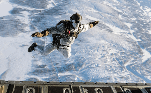 a person is jumping out of a plane with the letter u visible