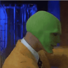a man wearing a green mask and a hat is saying somebody