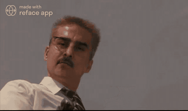 a man with a mustache is pointing a gun at the camera with the words made with reface app behind him