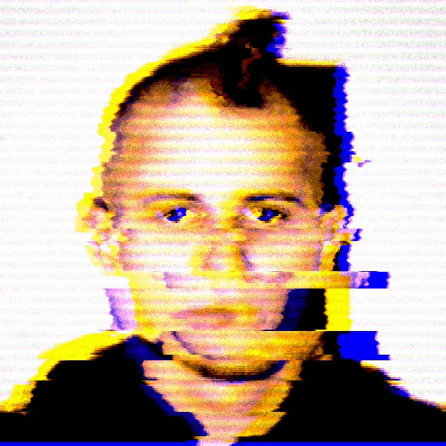 a blurry picture of a man 's face with a yellow and blue background