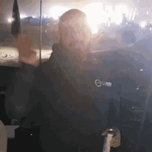 a man in a black jacket with volvo on it