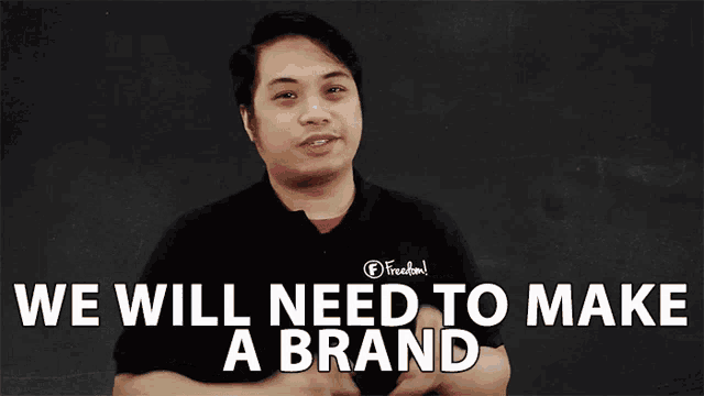 a man wearing a black shirt that says freedom says we will need to make a brand