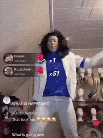 a person in a blue shirt with the number 51 on it is dancing