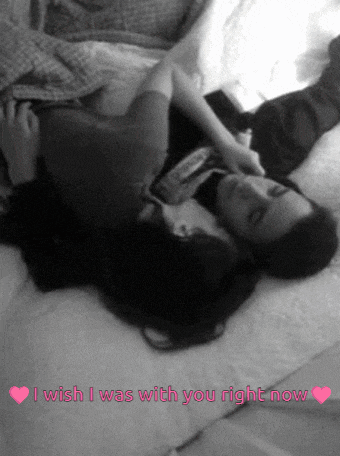 a couple laying on a bed with the words i wish i was with you right now in pink