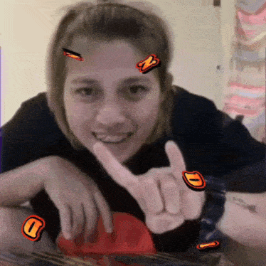 a woman with stickers on her face including one that says n