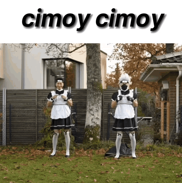 two maids are standing in front of a house with the words cimoy cimoy on the top