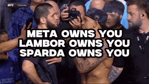 a group of men standing in front of a sign that says meta owns you lambor owns you spada owns you