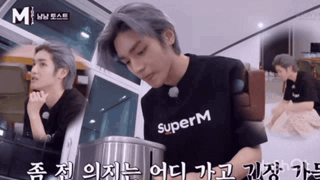 a man wearing a black shirt that says superm is cooking