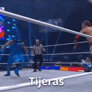 a wrestling match with the words tijeras written on the ropes