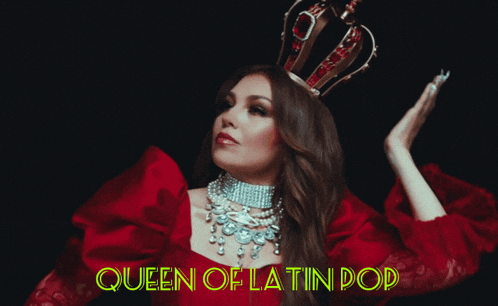 a woman in a red dress with a crown on her head and the words queen of latin pop above her