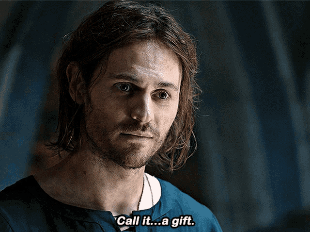 a man in a blue shirt says call it a gift