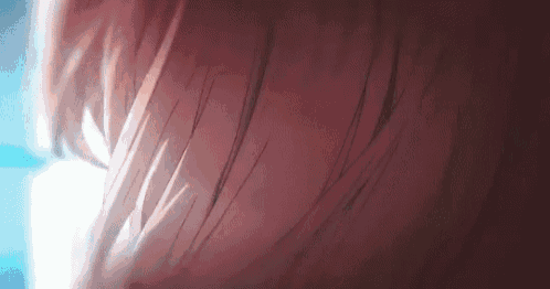 a close up of a person 's hair with a blue light shining through it .
