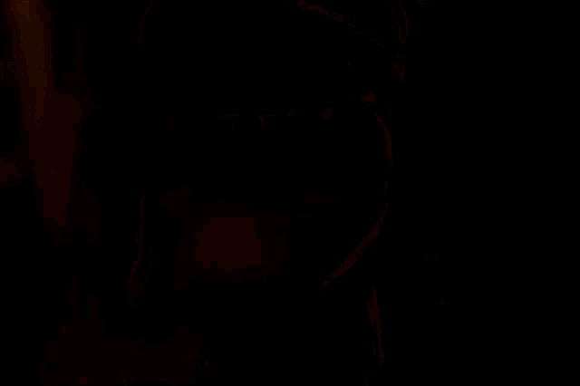 a woman wearing glasses and a hat looks at the camera with a surprised look on her face