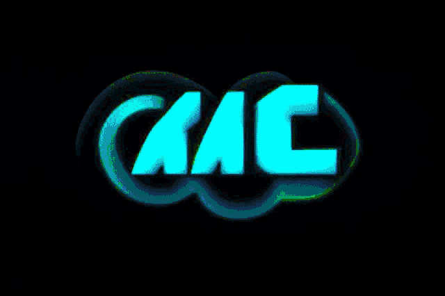 the mac logo is glowing in the dark on a black background .