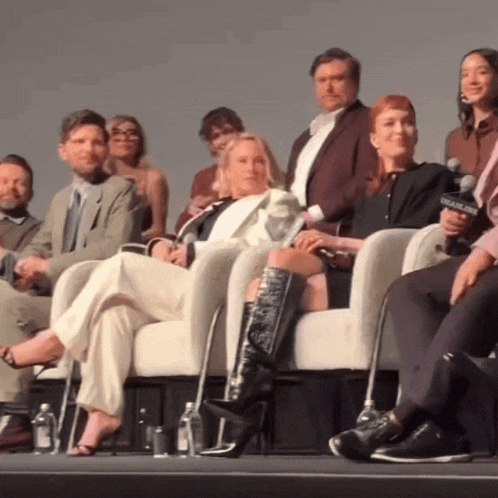 a group of people are sitting on a stage with a microphone that says foxnews
