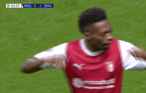 a soccer player is covering his ears during a game
