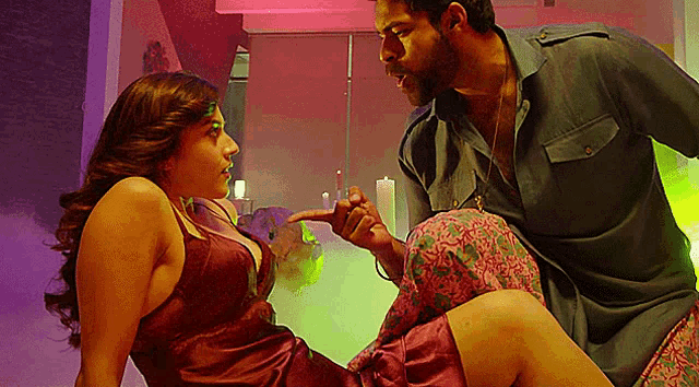 a man and a woman are having sex in a room .