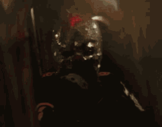 a blurred image of a person with blood coming out of their face