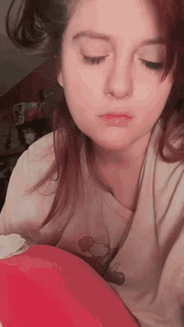 a close up of a woman with her eyes closed