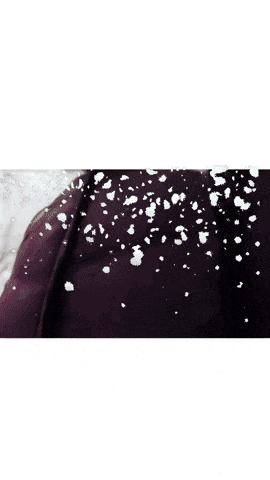 a man in a black jacket is standing in the snow