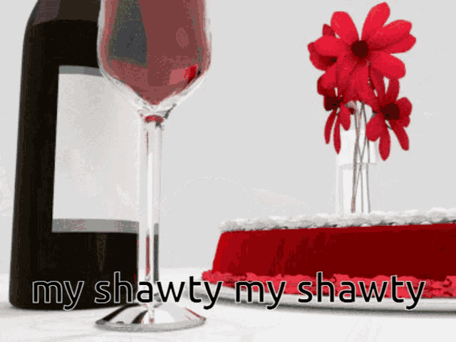 a bottle of wine a glass of wine and a cake with the words " my shawty my shawty " on the bottom