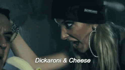 a woman is holding a banana over a man 's face with the words dickaroni & cheese written below her