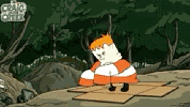a cartoon character is standing on top of a cardboard box .