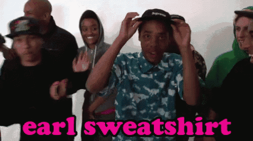a group of people wearing earl sweatshirts are standing together