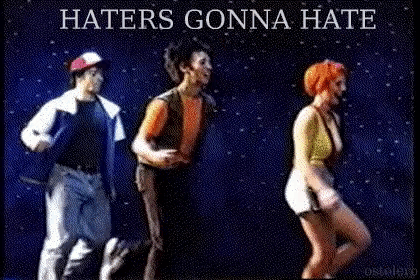 a group of people are dancing with the words haters gonna hate above them .