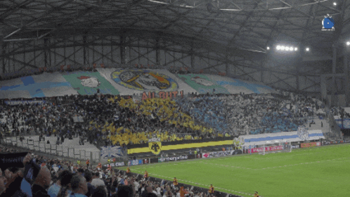 a soccer stadium with a banner that says " allianz " on it