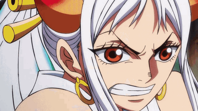 a close up of a woman 's face with a very angry look on her face