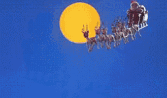 santa claus is flying in a sleigh pulled by reindeer in the sky