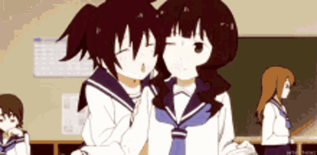 two anime girls are hugging each other in a classroom