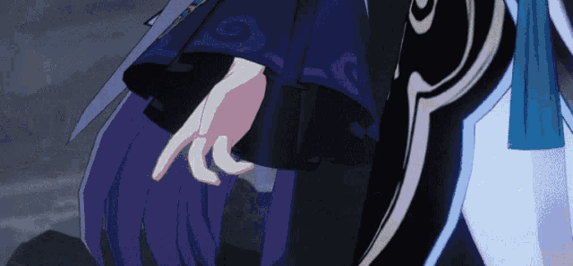 a close up of a person 's hand with purple hair and a blue ribbon