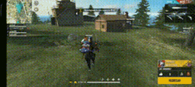 a person is playing a video game in a field with a building in the background .
