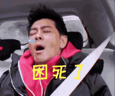 a man is sleeping in a car with his mouth open