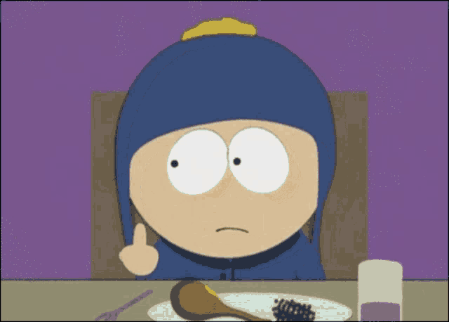 a cartoon character sitting at a table with a plate of food and a glass of water